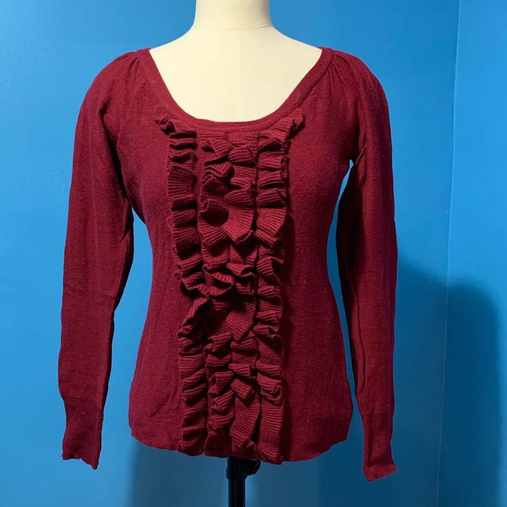 Claret red sweater.